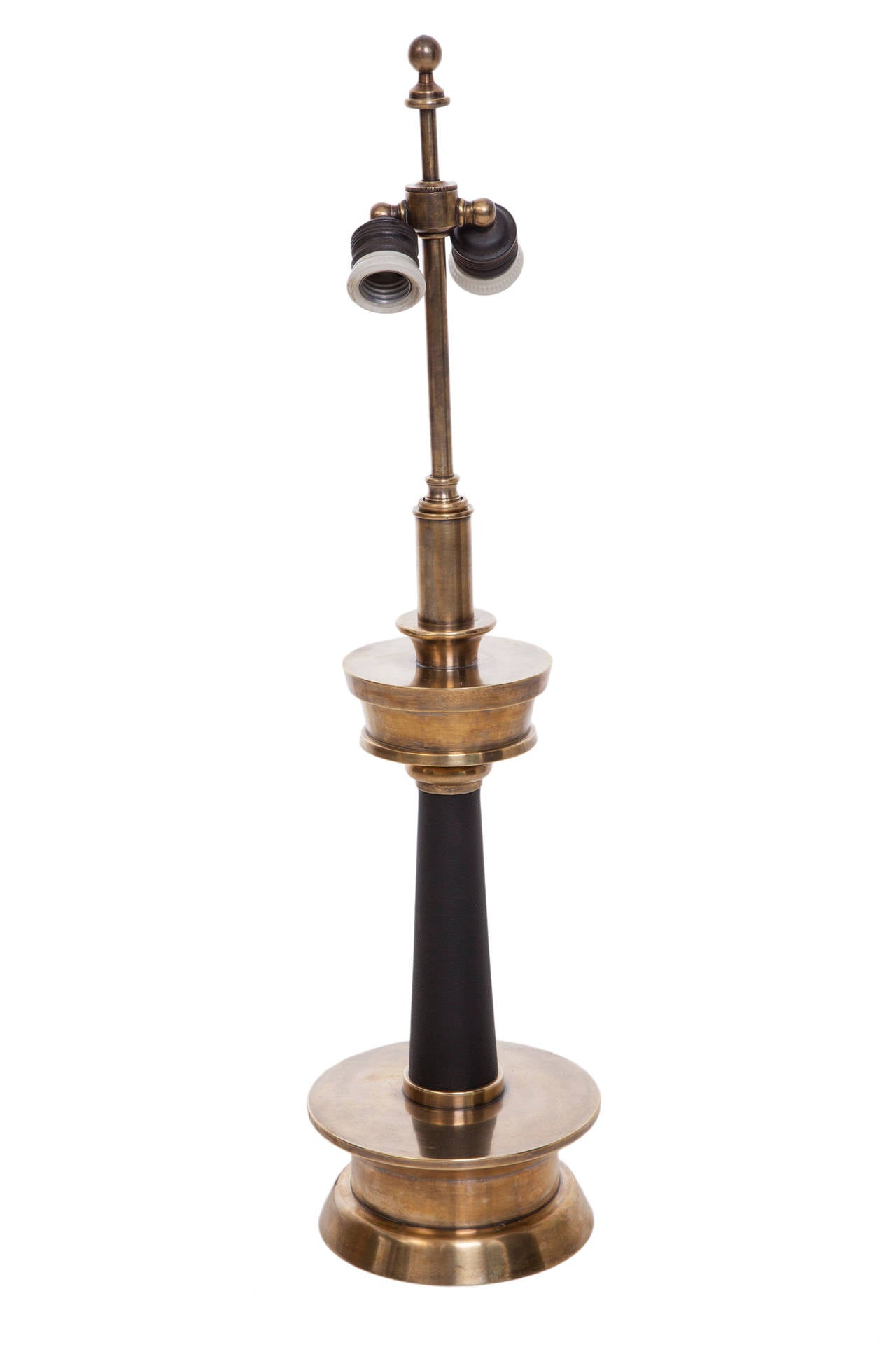 A pair of vintage, circa 1940s candlestick table lamps, with adjustable, double-cluster sockets, above a tapered, leather wrapped stem, with circular shoulder and base in brass. Wiring and sockets to US standard, each lamp requires two Edison base