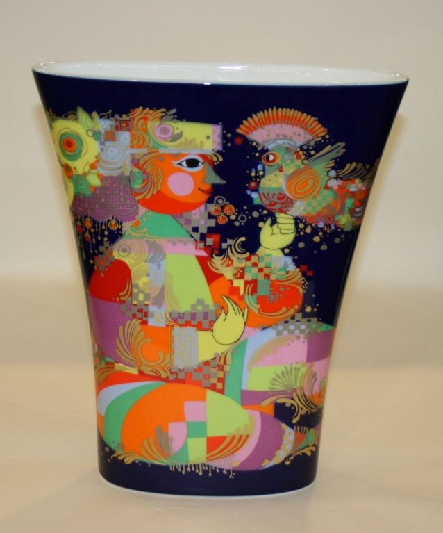 A Bjorn Wiinblad for Rosenthal porcelain vase with vibrant design over a midnight blue ground.