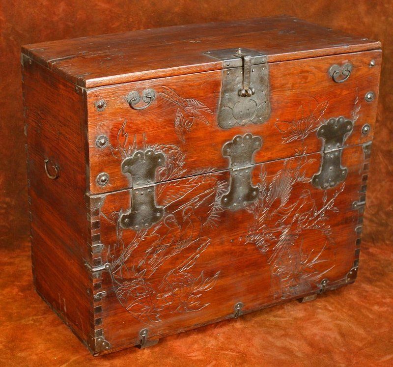 Antique Korean Bandaji (Front Opening Chest) from Cholla with a hand carved nature scene of auspicious Birds and Flowers, constructed of zelkova wood with swallowtail motif ironwork. The swallow is a symbol of beauty and pleasure in Korea.