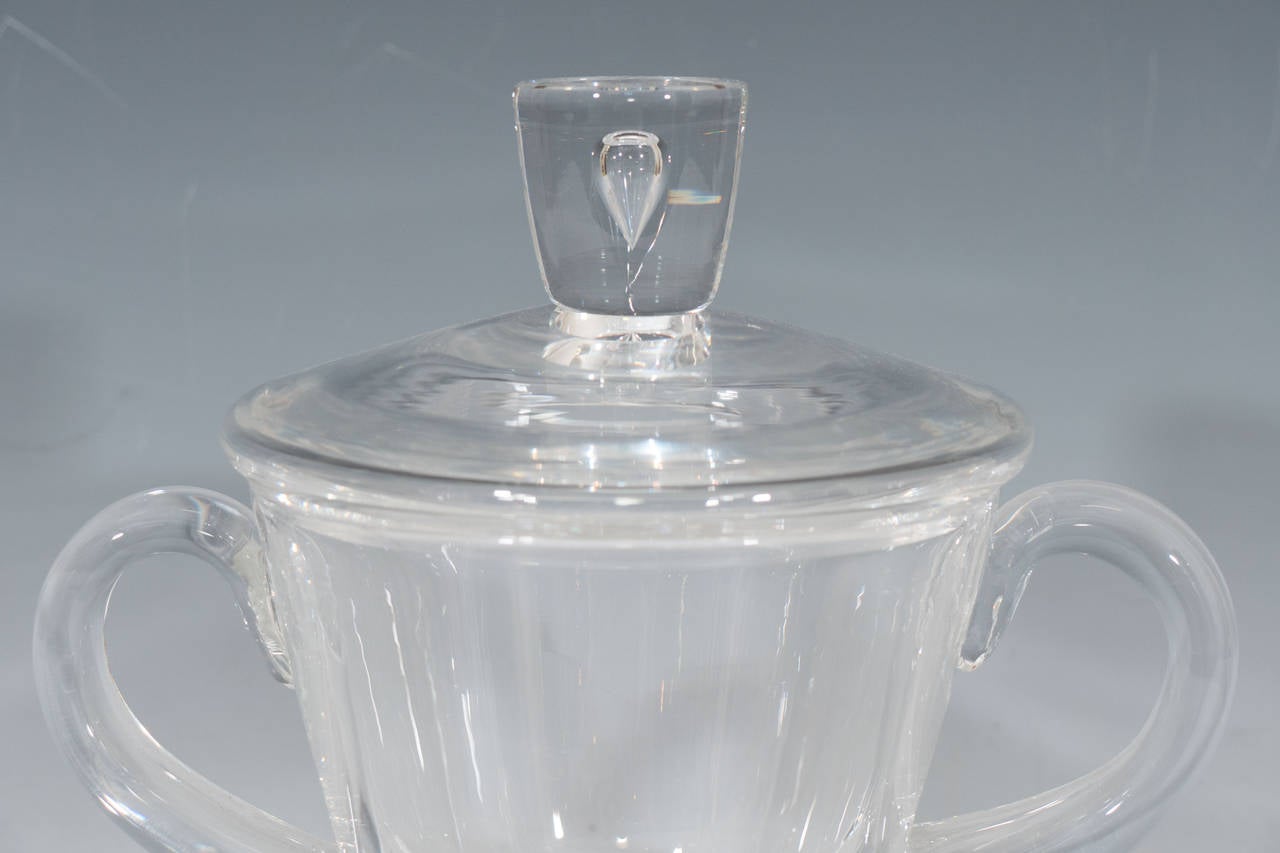 A Steuben signed teardrop double handled lidded urn or covered candy dish.