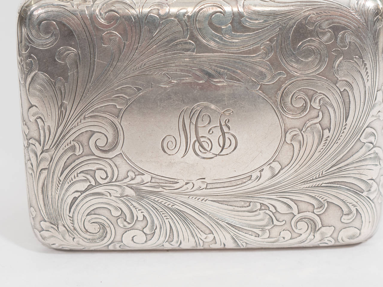 A sterling silver Art Nouveau decorative box or case by Tiffany & Co with gold clasp. This was formerly a purse.

Good vintage condition with age appropriate patina. Some scratches.
