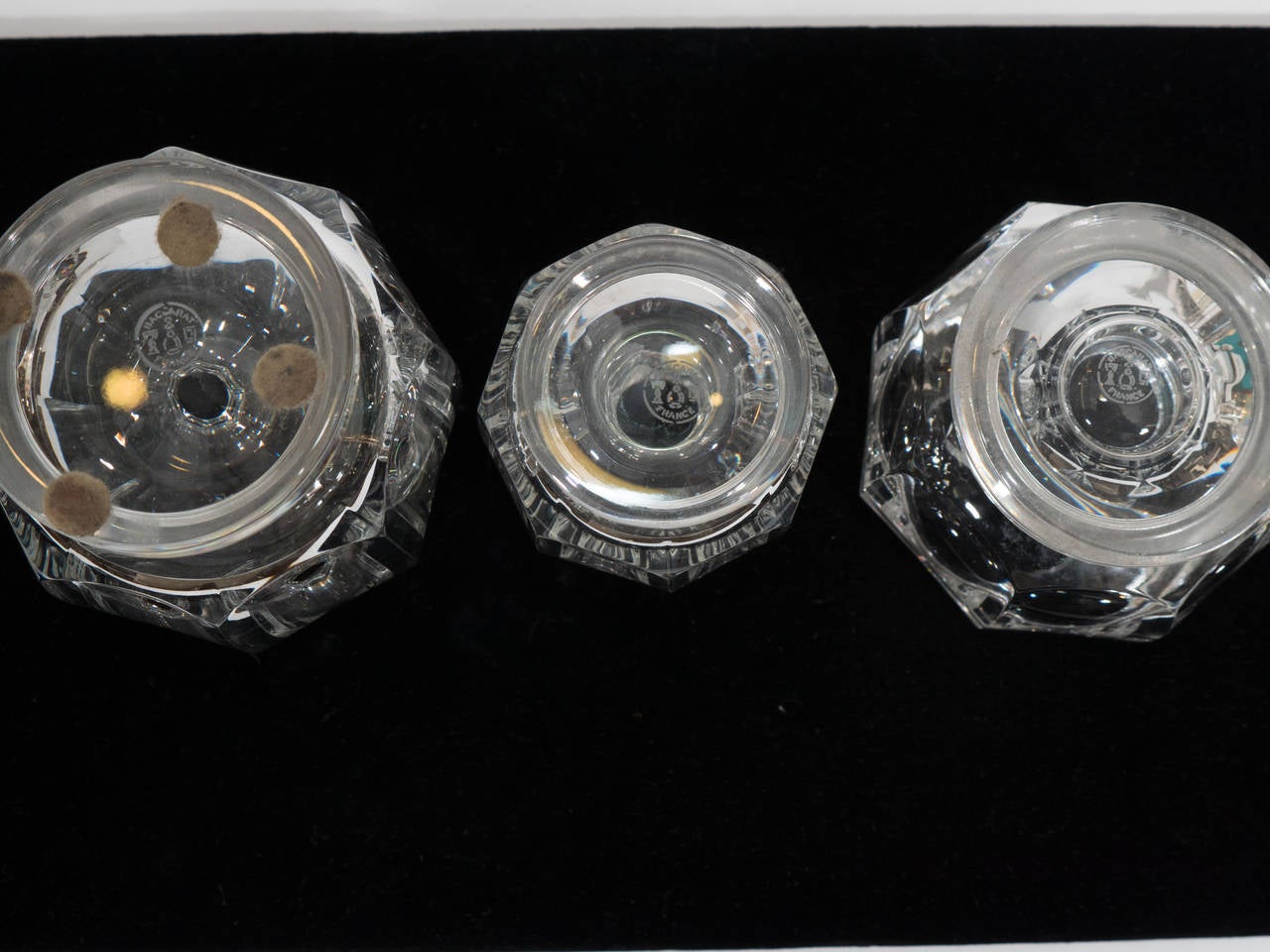 A dresser set consisting of three different size Baccarat clear glass cologne bottles. Marked Baccarat France on the bottom.

Good vintage condition with age appropriate wear.

Measures: Large: 7
