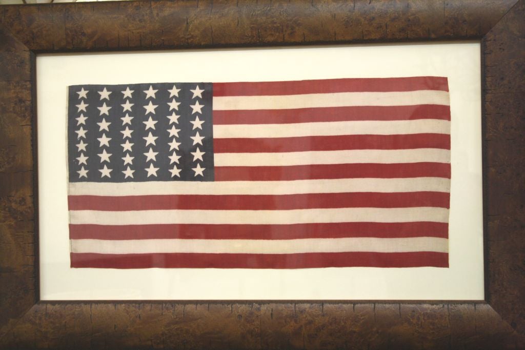Antique American flag with 39 stars in anticipation of two new states in 1875-76. Colorado was the only addition during this time however and the next flag count would include North and South Dakota, meaning 39 star flags were never an official