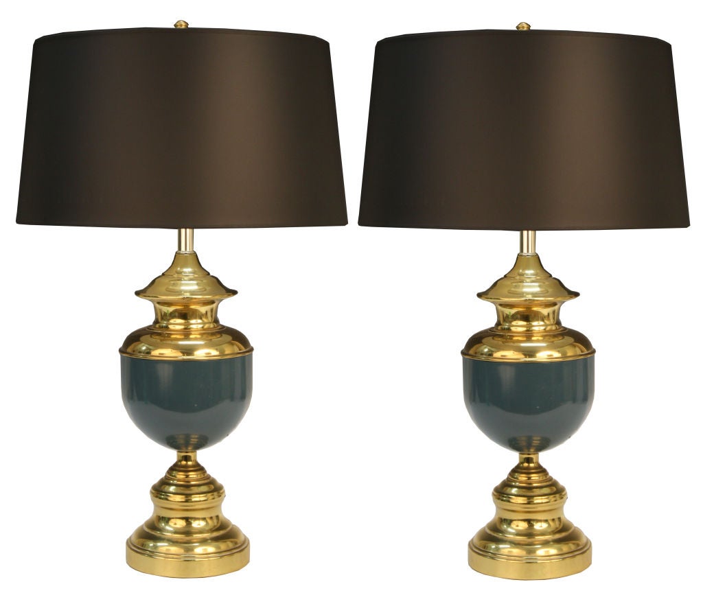 Pair of brass and enamel lamps paired with a black shade that gives these vintage lamps a contemporary feel.