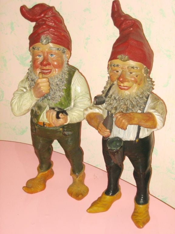 Charming pair of highly detailed garden or lawn gnomes. This garden ornamentation started in 18th-19th century Germany with the gnomes based on folklore and the idea that they would work the garden through the night while the owner slept. This