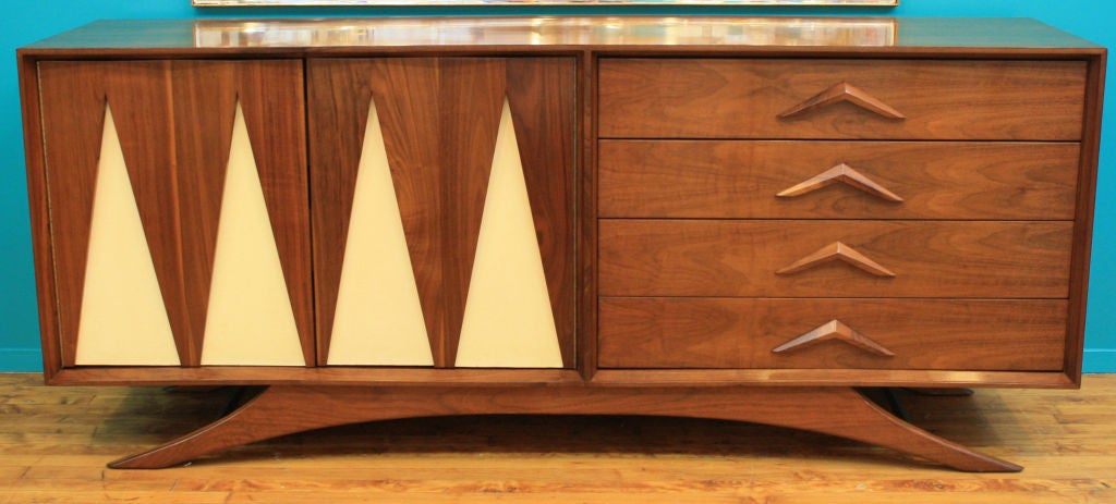 This stunning, mid century walnut credenza by Vladimir Kagan has been restored and French polished. There are four exposed drawers and two doors with leather inserts that open to three additional interior drawers.<br />
<br />
Reduced From: $14,500