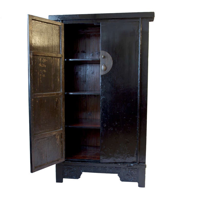 This is a cabinet designed to impress, both by its size, and its black lacquered finish. Chinese houses had little or no inbuilt storage, and thus cabinets were acquired for the storage of clothes and garments. Cabinets were thus highly visible, and