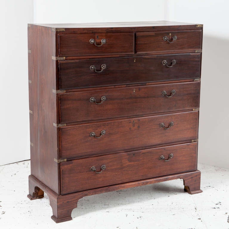 An unusually tall British campaign chest of drawers made of solid rosewood with brass corners. Two drawers over four, each drawer has brass handles and a keyhole. Chest sits on footed base.