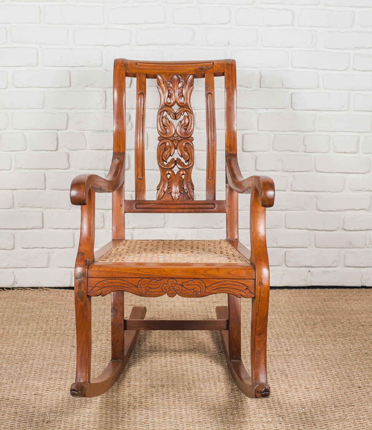 19th Century Indo-Portuguese Teak Rocking Chair with Caned Seat For Sale