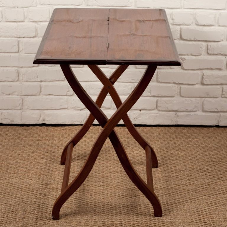 Anglo-Indian campaign style folding teak table with rosewood edge.