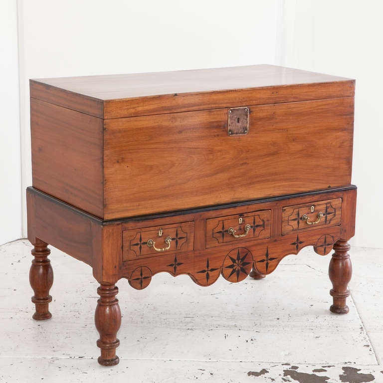 Description: Indo-Dutch colonial storage trunk made of solid single plank jackfruit with ebony details. The inside of the trunk has a document storage box and ample room in the main compartment. Base has ebony inlay details and ebony trim. Three