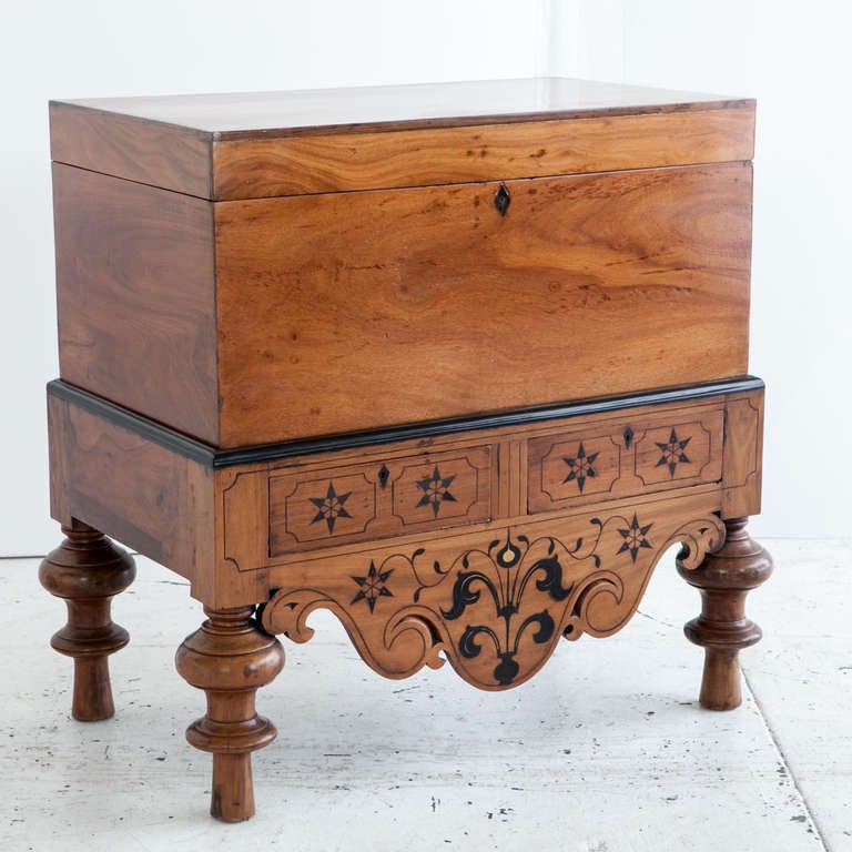 Indo-Dutch colonial storage trunk made of solid single plank jackfruit with ebony details. The inside of the trunk has a small document storage box as well as ample storage space. Base has ebony inlay details and ebony trim. Two flush fitted drawers