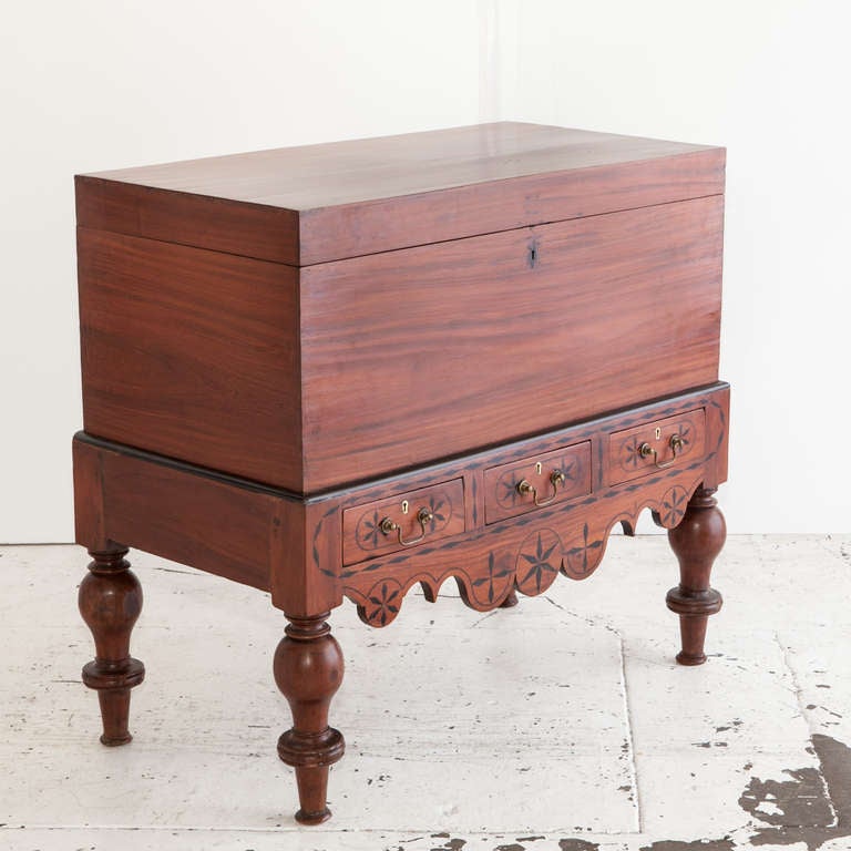Indo-Dutch colonial storage trunk made of solid jackfruit with ebony details. The trunk is made of solid single planks of wood. Base has ebony inlay details and ebony trim. Three flush fitted drawers in bottom frieze with ebony inlay and brass