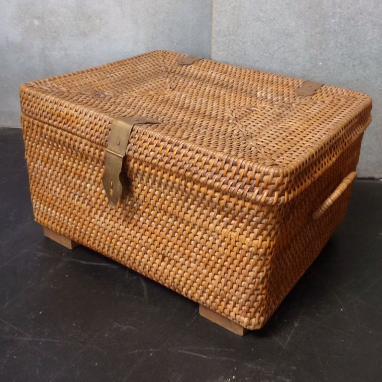 Woven rattan picnic basket with brass hardware. Inside has removable tray and cloth covered inside top.