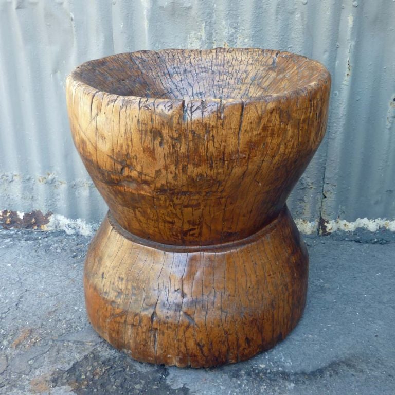 Solid tropical hardwood rice mortar from the Philippines. Inside has been hollowed out from years of use. Bottom is flat, makes a great planter or side table.