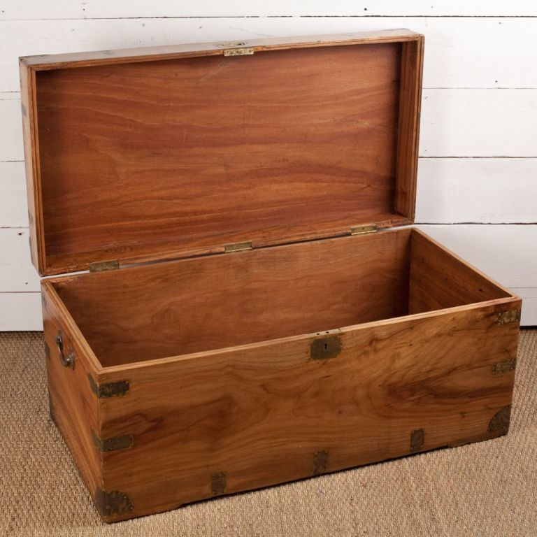 British campaign style trunk in camphorwood with brass details. Inside has small document compartment.