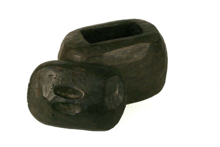 This Bontoc Meat Container is from the Philippines. It is rustically carved with an inset handle on the lid.