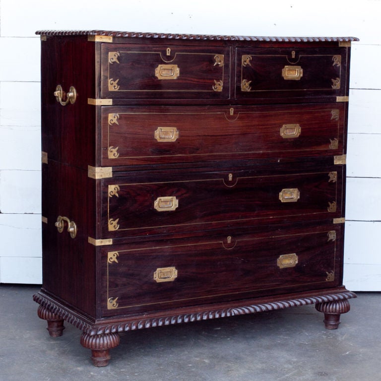 Anglo-Indian solid rosewood chest of drawers in two parts. Solid brass side handles and inset brass handles with decorative brass inlay and brass escutcheons on drawer fronts.