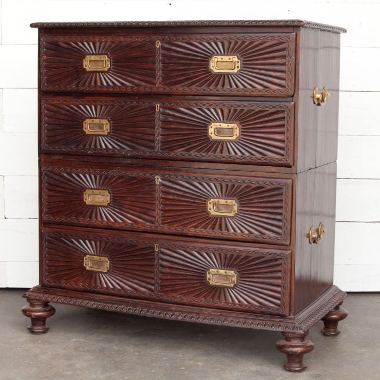 Indo-Portuguese solid rosewood secretaire with sunburst carved drawer fronts. Chest is in two parts base rests on turned feet. Solid brass handles and brass inset handles.