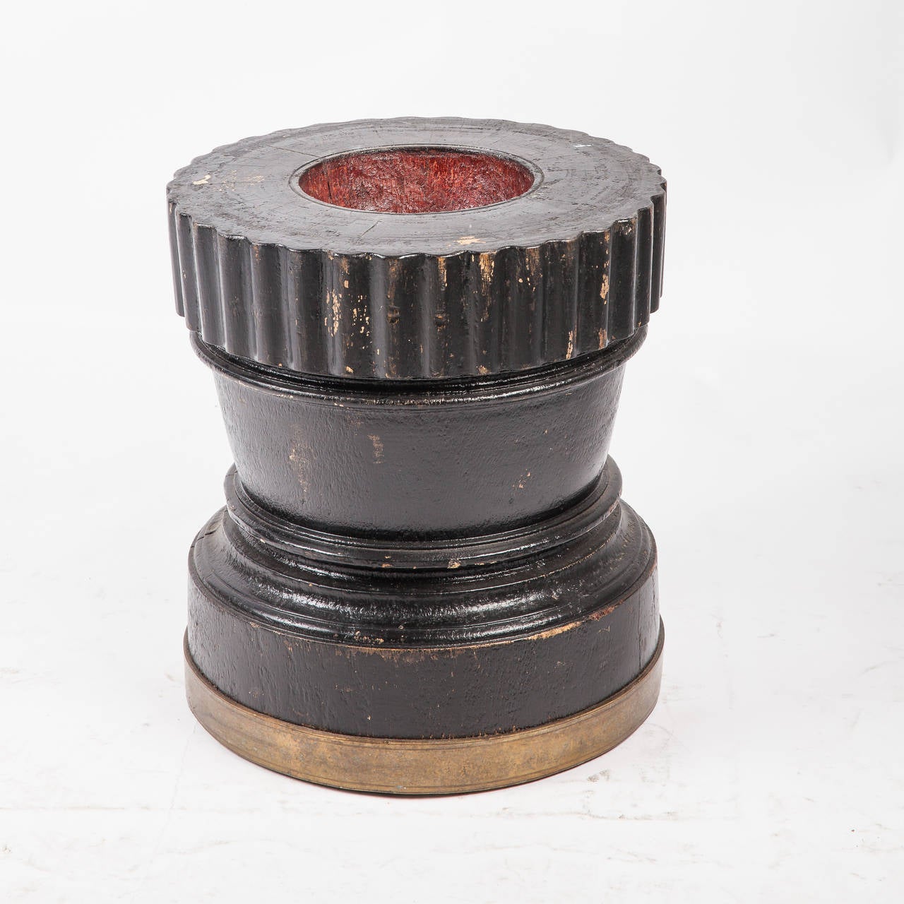 Solid wood rice grinder from Southern India with scalloped edge and brass detail at base. Rice was poured into the top concavity and pounded into flour using a heavy wooden pole. Makes a great side or drink table. Others are available.