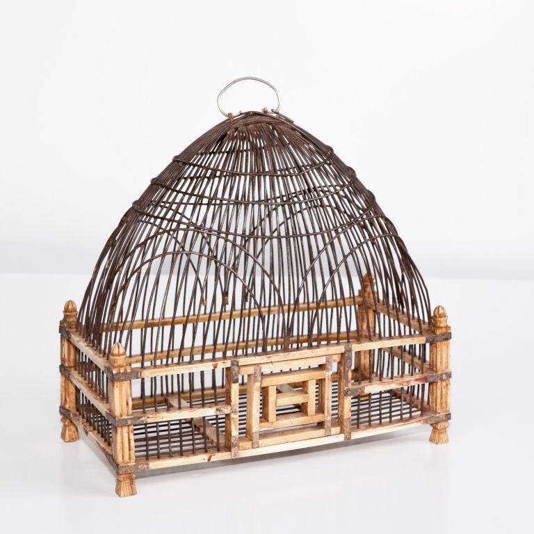 Mughal ivory birdcage with silver mountings, the iron frame with domed top supported on a carved ivory frame