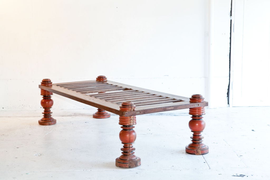 Large hand painted wood daybed from Southern India. The entire piece can be dismantled.