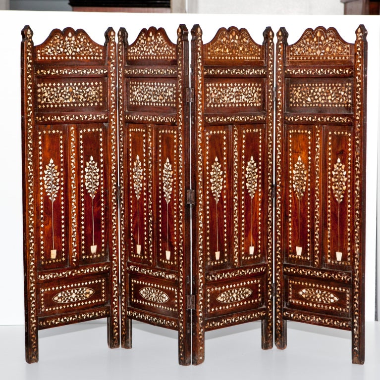 A four panel folding screen made of solid rosewood and inlay. Was probably a fireplace screen.
