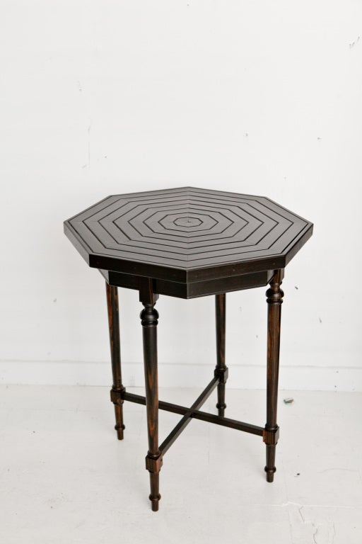 Dutch Colonial solid ebony octagonal top side table. Table top has groved markings. Beautiful ebony graining throughout.