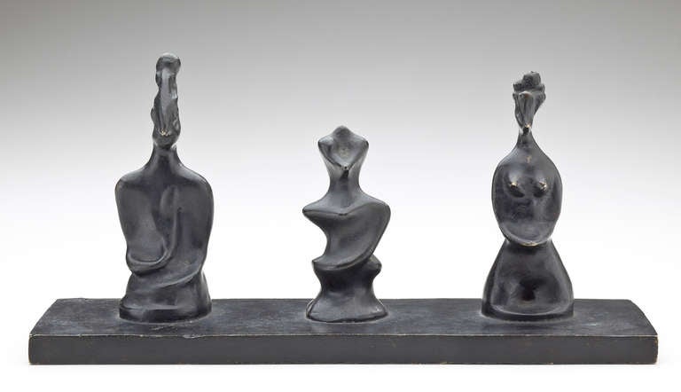A cast bronze sculpture of three chess pieces by surrealist artist, Max Ernst (1891-1976).  Designed by Ernst in 1929-30, he titled the sculpture, 