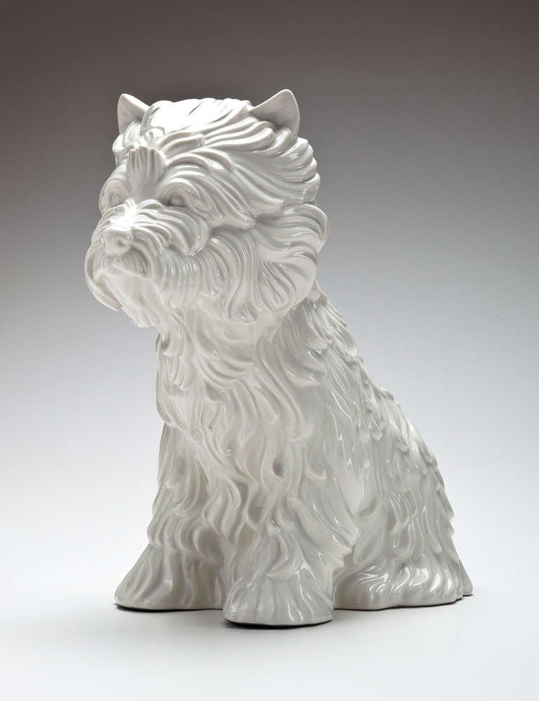 Jeff Koons (b.1955) Puppy Vase 1998.   This work in glazed white ceramic is number 1254 from an edition of 3000. The puppy has a insert in his back so that he/she can hold a full vase of flowers adding to its charm. The base has an incised