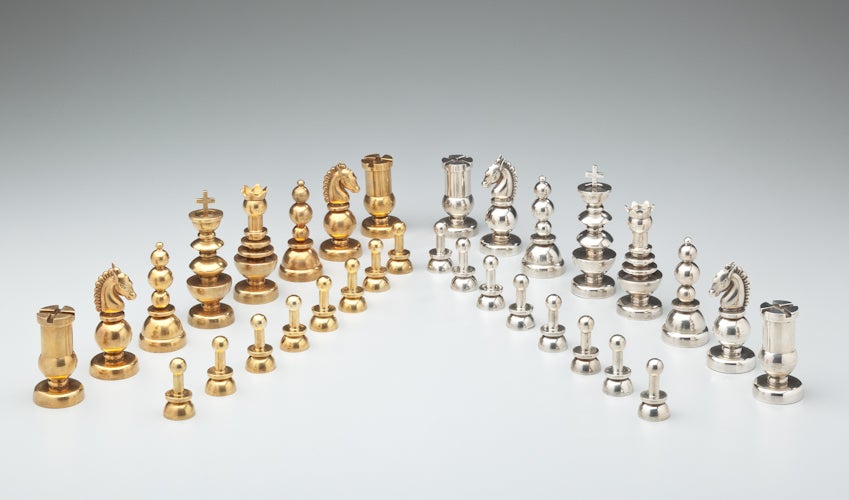 A sterling silver and vermeil sterling chess set by Mexican modernist designer, Hector Aguilar.  Thirty-two pieces total.  Except for the pawns, all pieces are signed with Aguilar's 