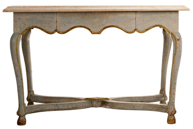 Ladies desk or dressing table, dove gray painted finish with gold decoration, one drawer in the scalloped apron, hoof foot beneath curved and molded X stretchers with a carved diamond at the crossing. Crema marfil marble rectangular top with deep