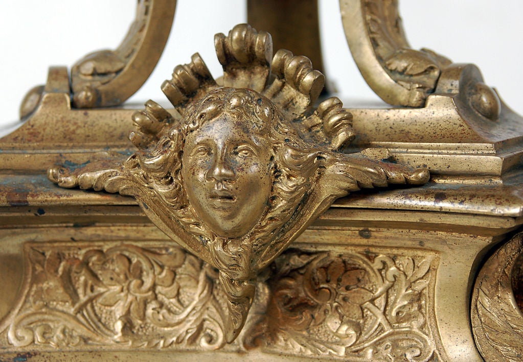 These substantial and opulent chenets are cast in exquisite detail. The chenets are flanked by fierce lions, adorned with laughing satyr masks and festooned with climbing curls of acanthus foliage. This decorative motif is archetypical of the early