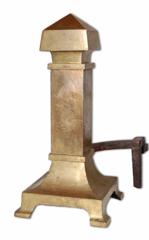 These andiorns are architectural in form: Pyramid finials top square columns that terminate in bracketed feet.  Their form is flawlessly fitted to their function.  The material used is of the highest quality: bronze instead of brass. They are also