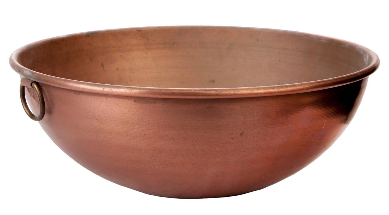 Four copper mixing bowls of graduating sizes: 14.5 x 7, 12 x 6, 10 x 5.25, 8.5 x 4.5, with brass loop hanging handles.