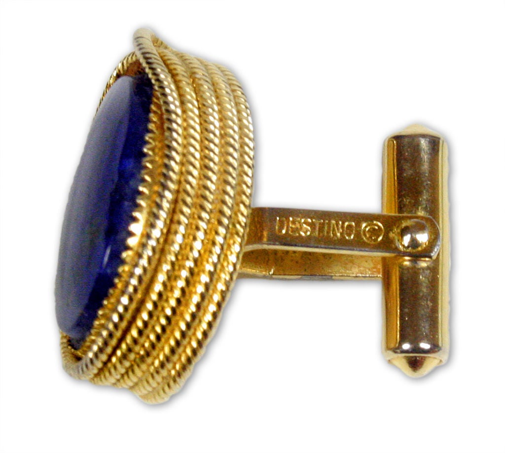 These cufflinks were designed by Ralph Destino for Saks Fifth Avenue in the 1960s.  A wonderful golden rope lassos around a deep blue lapis lazuli jewel.