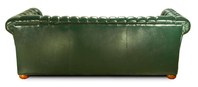 Fabulous hunter green sleeper sofa with nailhead detail and tufted leather would compliment a game room pool table or private library. A Chesterfield piece at its best. There is no sleeper mattress due to matttress laws. We can contact your local