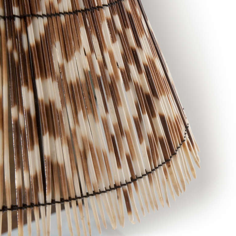 Unique African porcupine quill lampshade sits atop a chrome lamp stand spiraled by a black stained kudu horn. Light up your life with this sharp folk style, yet contemporary conversation piece!