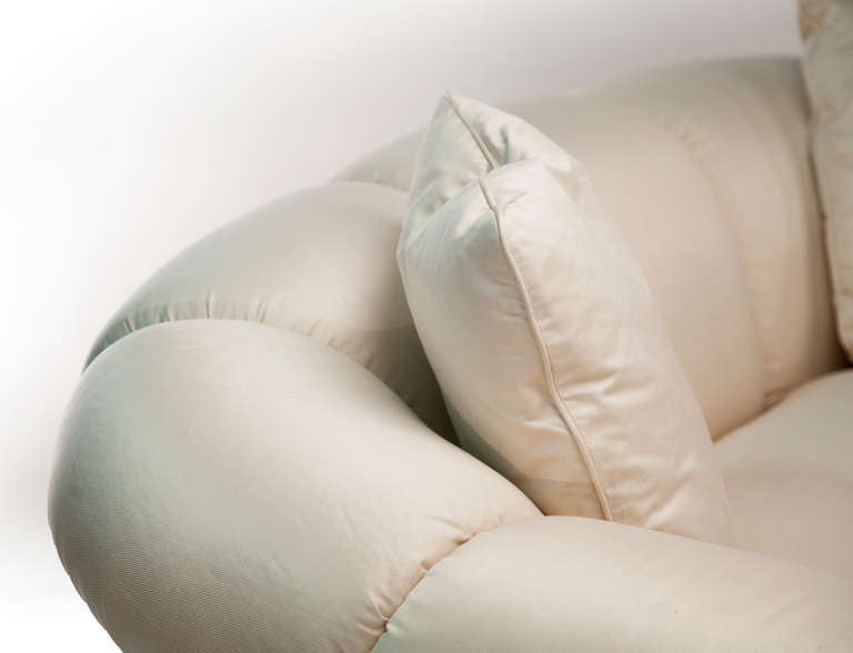 This beautiful raw silk sofa has pin-tucked arms and pleated skirt with matching throw pillows. Shear perfection?