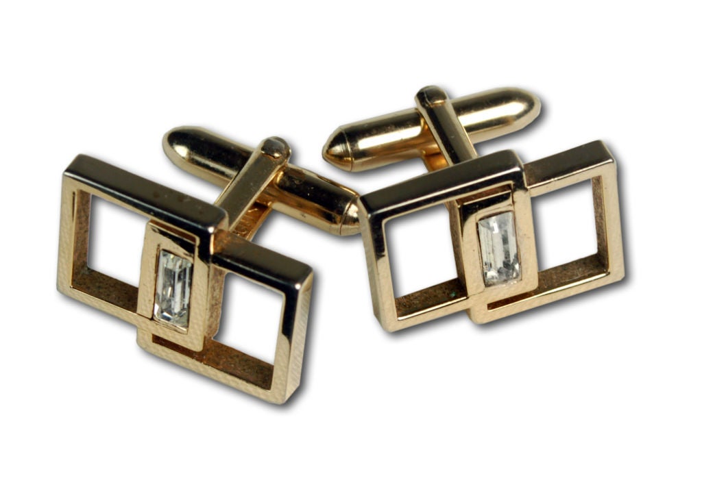 Wonderful modernist cufflinks by Swank. Interlocking cubes glisten with a rhinestone at their intersection.
