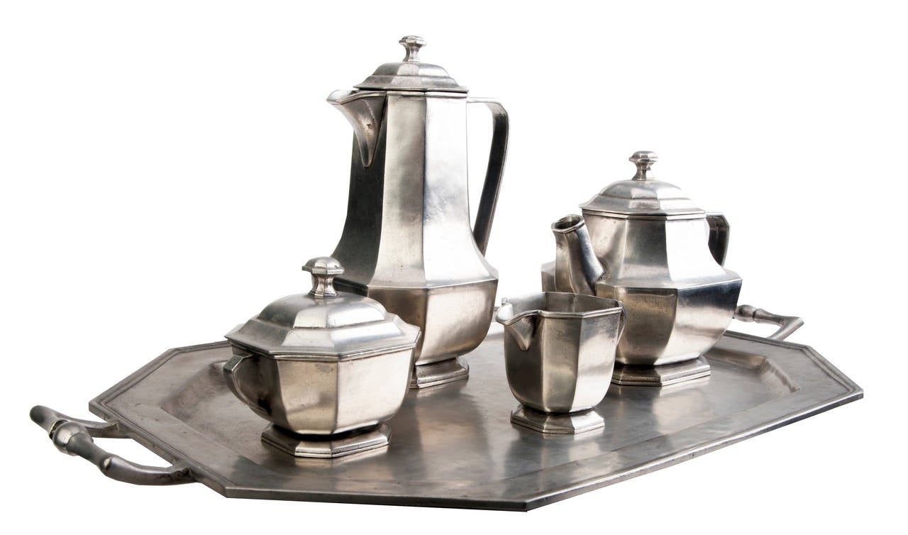 Exquisite Italian five-piece pewter tea set. Coffee and tea pots, cream and sugar.
Tray with nice handles.