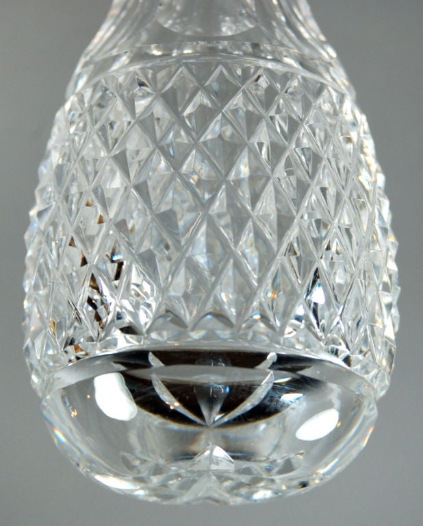 This clear and bright Waterford crystal bud vase is cut in the classic Lismore pattern.