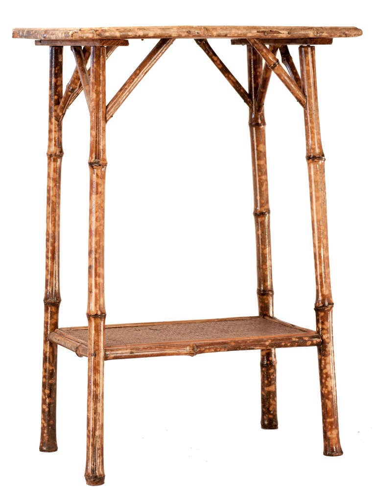Victorian Plant Stand, bamboo framing with tortoise shell finish, woven cane on top and lower shelf.
