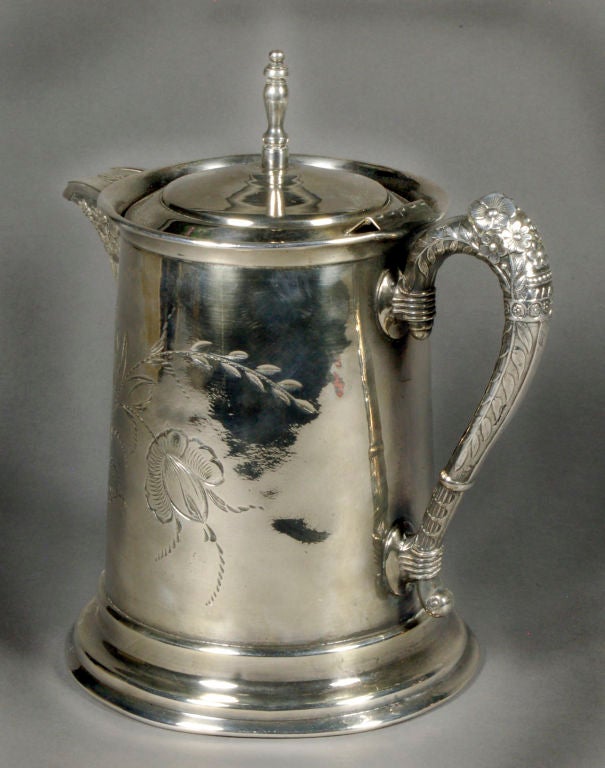 This elegant example of Aesthetic Movement silver was manufactured by ORF Silver Company. This decorative motif clearly displays the influence of Japanese art on Victorian design. The design of this pitcher suggests a date after the US Central