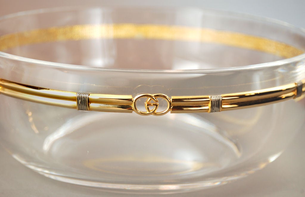 The Gucci brand became famous for its unique mix of innovative audacity and legendary Italian quality and craftsmanship. This leaded crystal bowl is a prime example of what makes Gucci, Gucci. A 24-karat gold band surrounds this handmade crystal