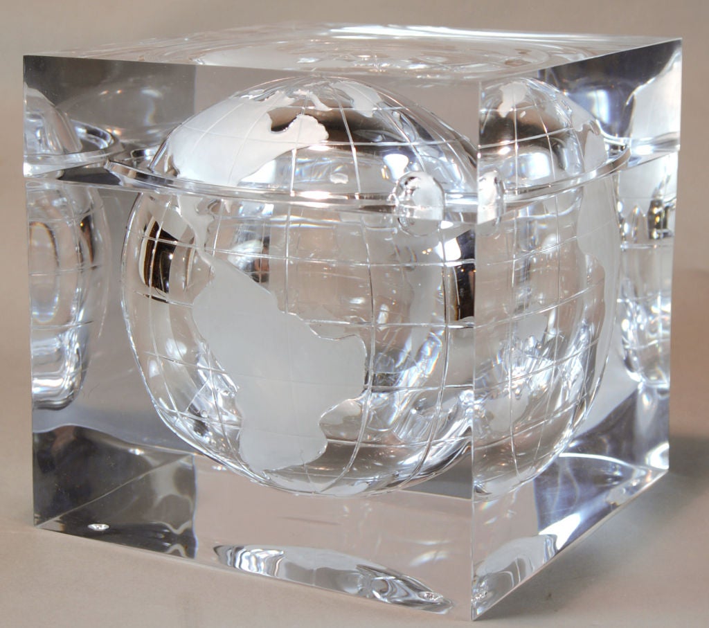 This vintage Lucite ice bucket features an etched internal globe and orbiting moon. In the manner of the jet set designer, and lover of the acrylic medium, Alessandro Albrizzi. The thick Lucite is as clear as glass and as brilliant as crystal. This