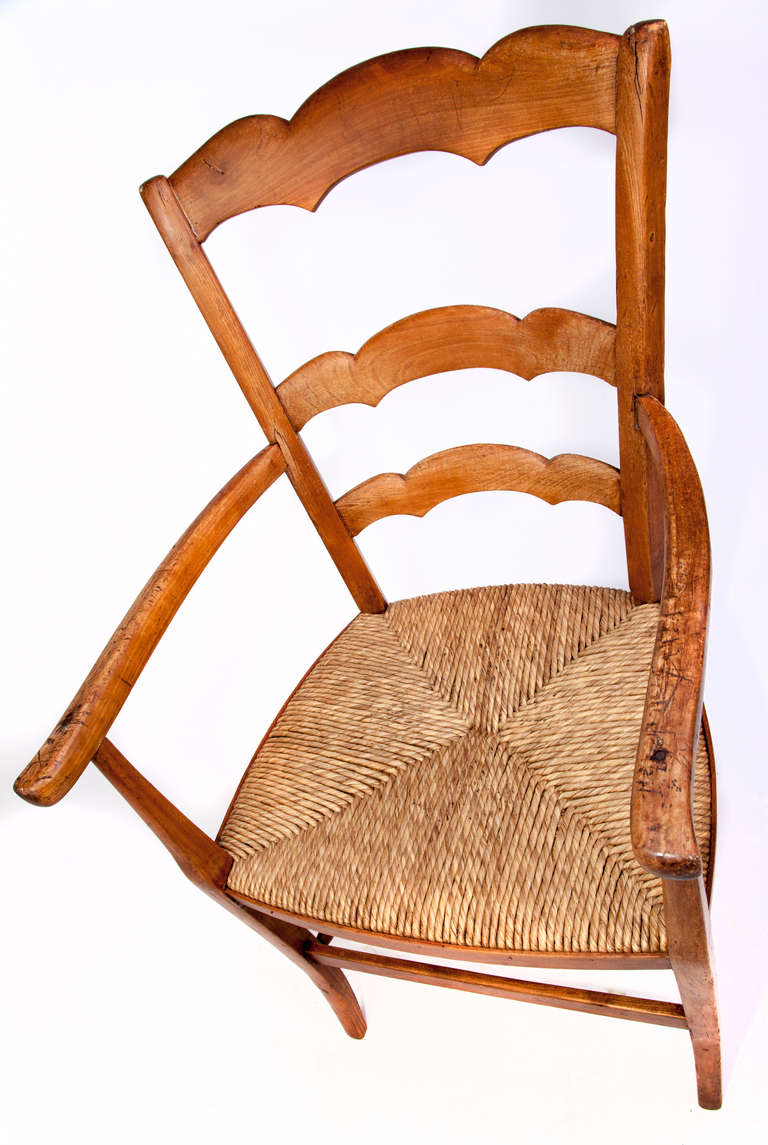 French country armchair with straw seat.
