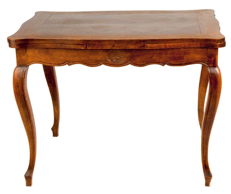 Beautiful walnut marquetry from France, scalloped edging, cabriole legs and hide-away leaves with wooden pull-out pegs.