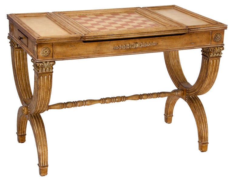 Neo-classical style gaming table with reversible top will afford a game of checkers, chess, or not. With private drawers for each partner and side drawers and side stations for cocktails, its the perfect size for setting an amusement corner. Tres