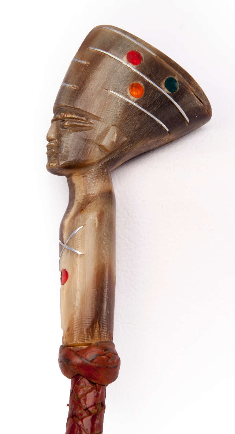 Old braided leather riding crop with bejeweled carved Horn Egyptian pharaoh head handle.